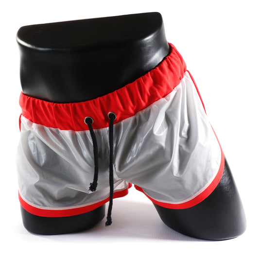 Mini - Short Vinyle – Blanc & Orange
Mini short vinyle blanc et orange effet brillant, créé par Omar Enrique Paris – mode masculine futuriste et style urbain.