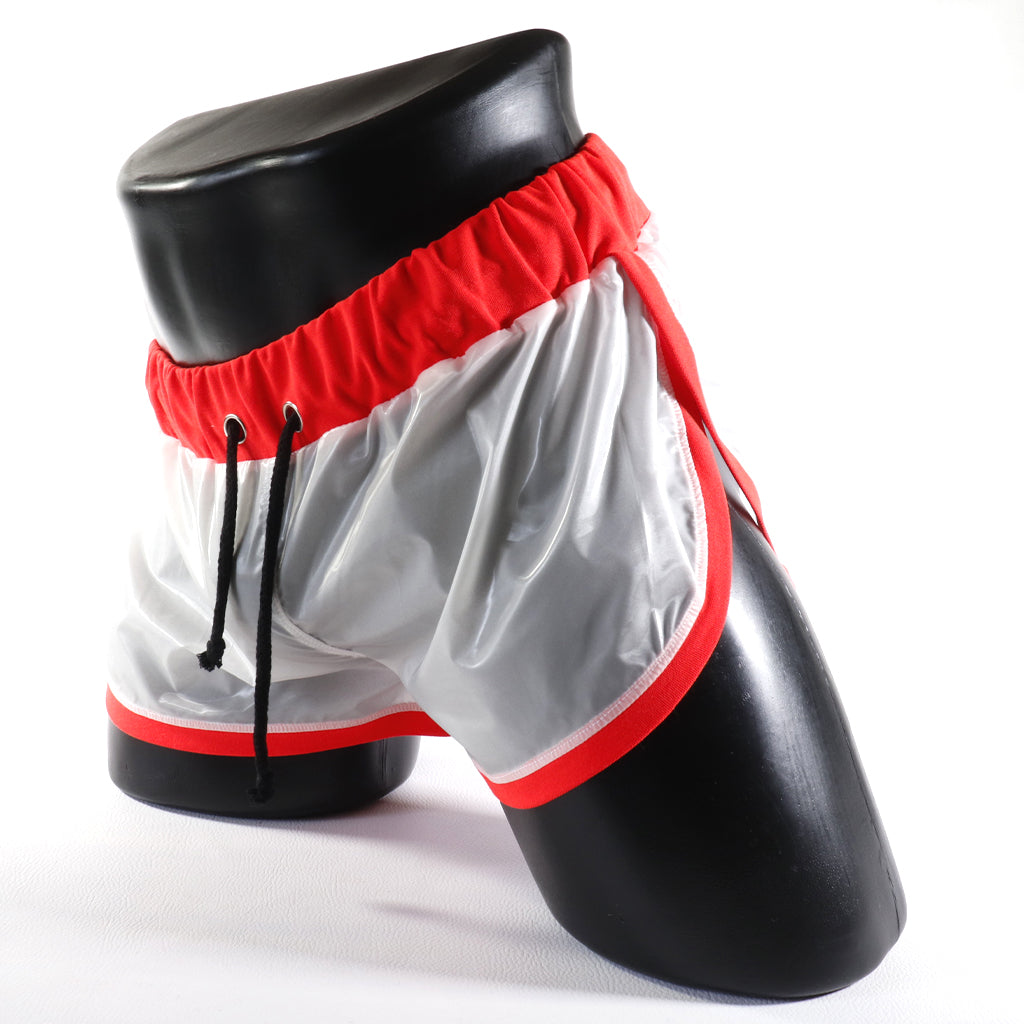 Mini - Short Vinyle – Blanc & Orange
Mini short vinyle blanc et orange effet brillant, créé par Omar Enrique Paris – mode masculine futuriste et style urbain.