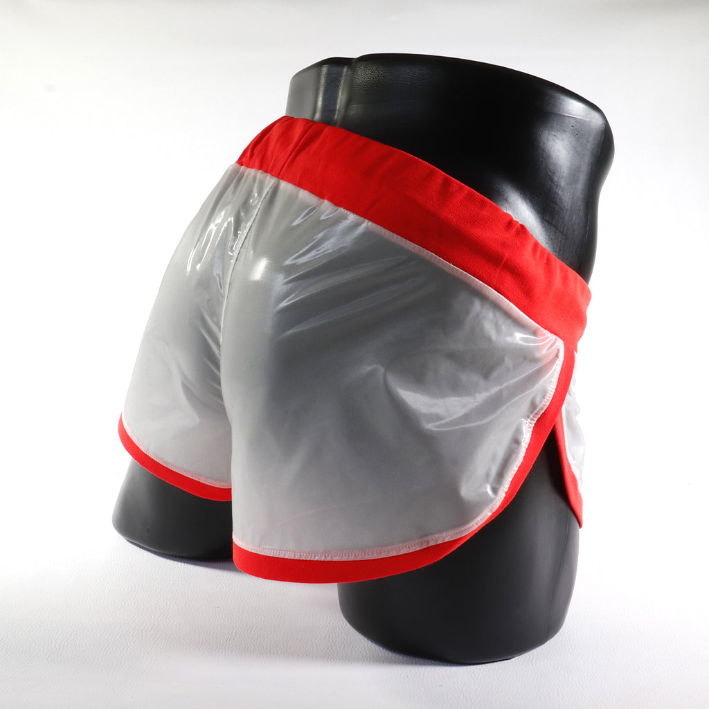 Mini - Short Vinyle – Blanc & Orange
Mini short vinyle blanc et orange effet brillant, créé par Omar Enrique Paris – mode masculine futuriste et style urbain.