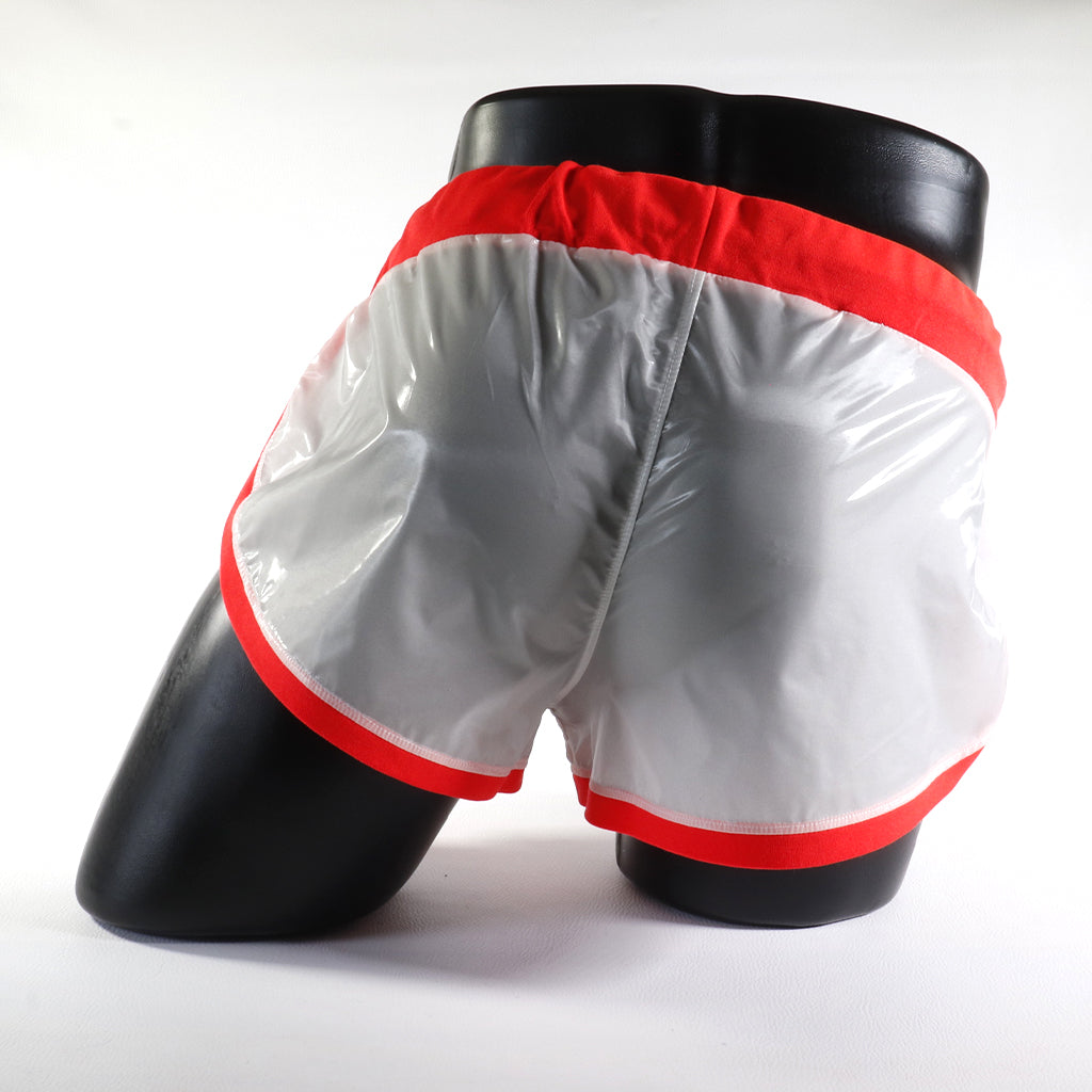 Mini - Short Vinyle – Blanc & Orange
Mini short vinyle blanc et orange effet brillant, créé par Omar Enrique Paris – mode masculine futuriste et style urbain.