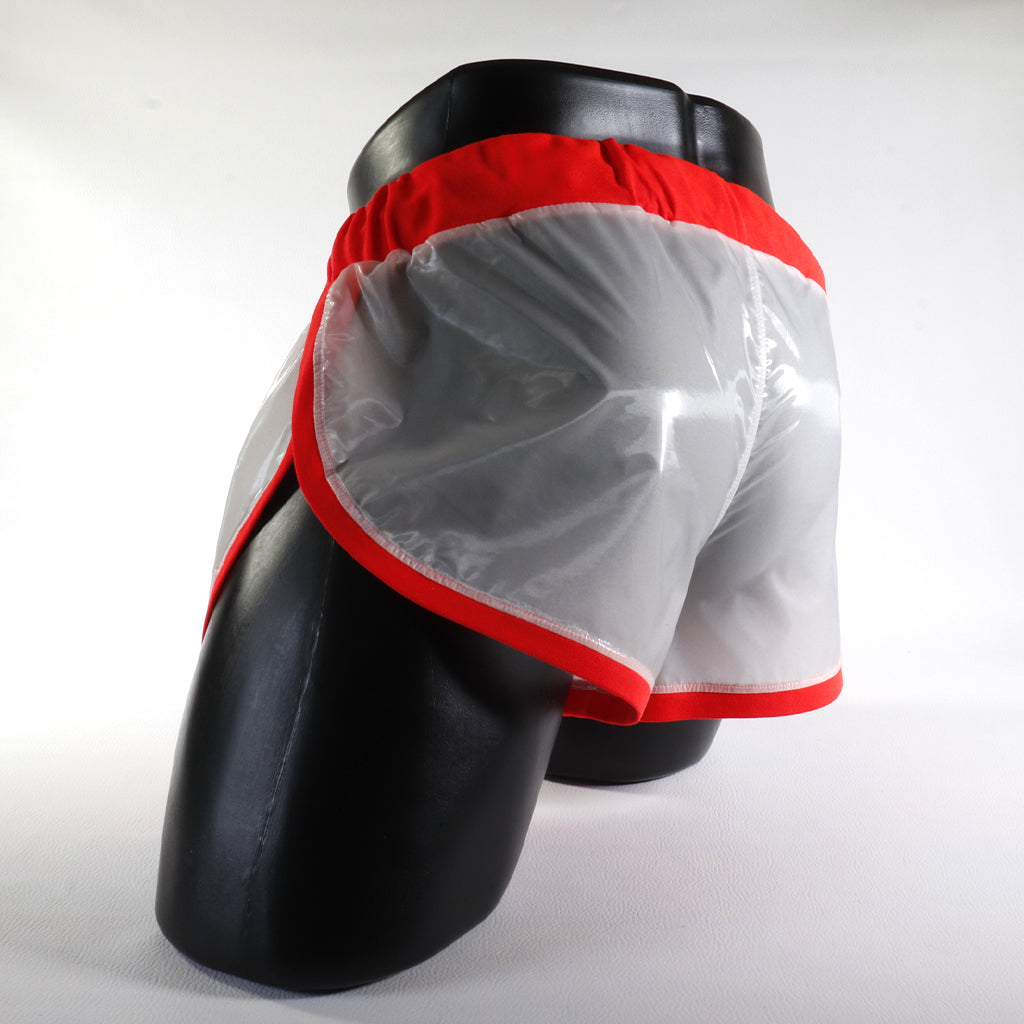 Mini - Short Vinyle – Blanc & Orange
Mini short vinyle blanc et orange effet brillant, créé par Omar Enrique Paris – mode masculine futuriste et style urbain.